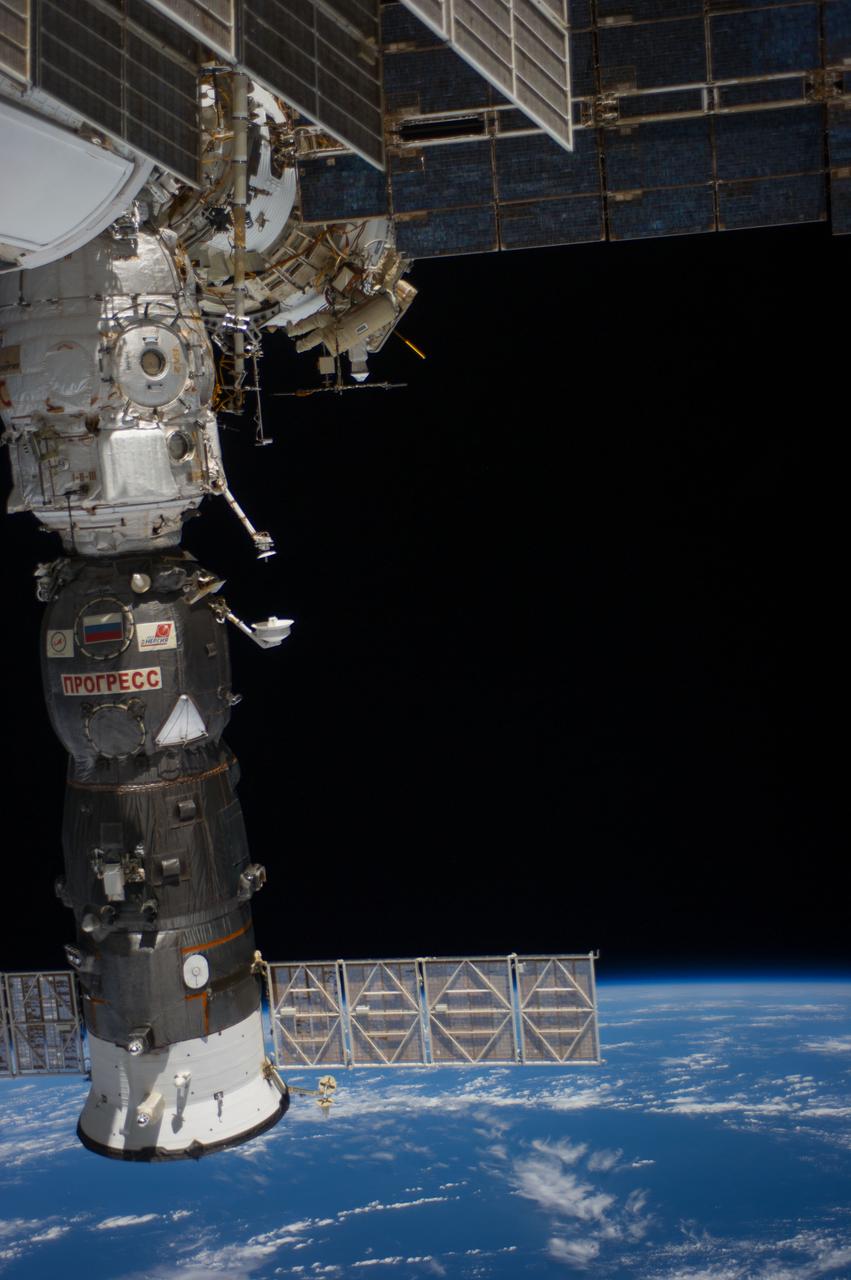 ISS040-E-015755 (19 June 2014) --- Russian cosmonauts Alexander Skvortsov (red stripes) and Oleg Artemyev, both Expedition 40 flight engineers, participate in a session of extravehicular activity (EVA) as work continues on the International Space Station. During the seven-hour, 23-minute spacewalk Skvortsov and Artemyev completed installation and experiment tasks outside the station’s Russian segment. The Progress 55 spacecraft, currently docked to the Pirs Docking Compartment, is at left.