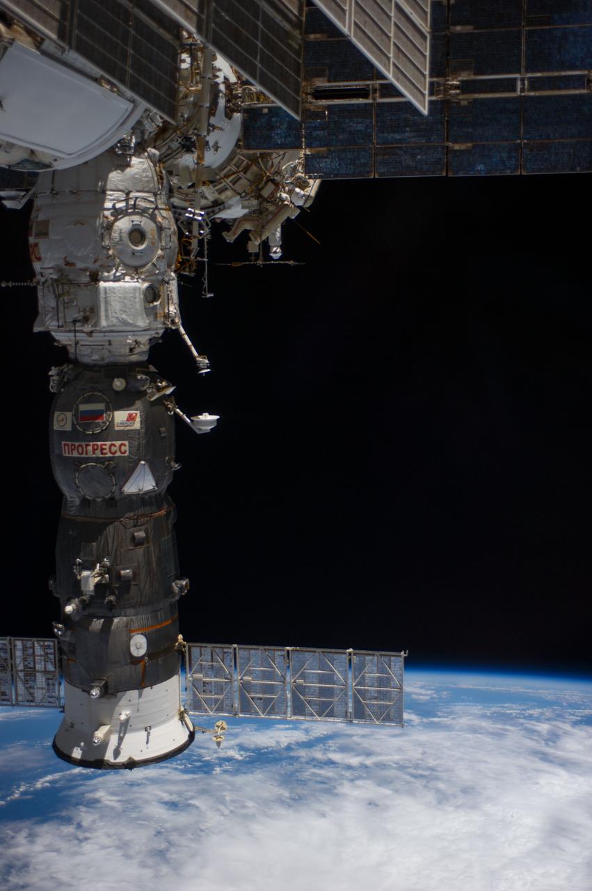 ISS040-E-015756 (19 June 2014) --- Russian cosmonauts Alexander Skvortsov (red stripes) and Oleg Artemyev, both Expedition 40 flight engineers, participate in a session of extravehicular activity (EVA) as work continues on the International Space Station. During the seven-hour, 23-minute spacewalk Skvortsov and Artemyev completed installation and experiment tasks outside the station's Russian segment. The Progress 55 spacecraft, currently docked to the Pirs Docking Compartment, is at left.
