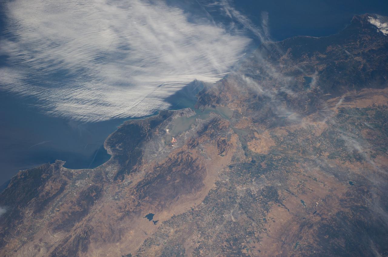 ISS040-E-016423 (20 June 2014) --- One of the Expedition 40 crew members aboard the International Space Station recorded this view of the central Pacific Coast area of California on June 20, 2014. Monterey and Monterey Bay and part of the Santa Lucia Mountains are in the lower left corner, and the San Francisco Bay area is near frame center, with part of the view of the area being obstructed by coast-hugging clouds.