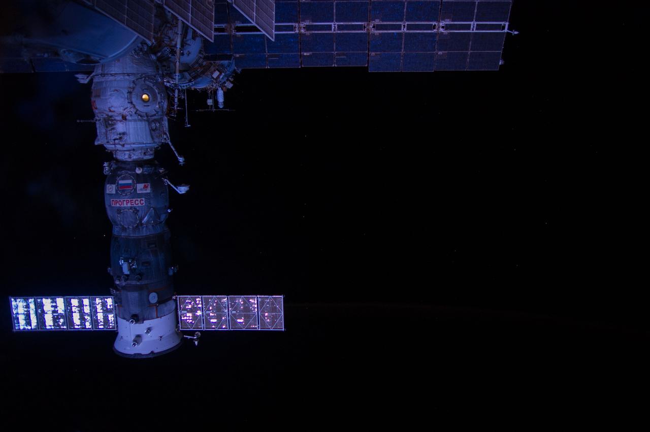 ISS040-E-017086 (23 June 2014) --- This nighttime view, featuring the ISS Progress 55 resupply vehicle docked to the Pirs Docking Compartment, was photographed by an Expedition 40 crew member on the International Space Station.