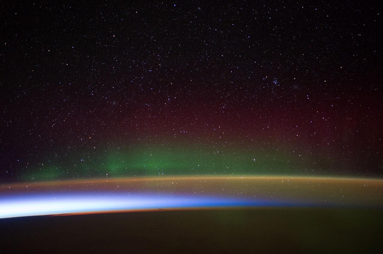 Earth Observation taken during a night pass by the Expedition 40 crew aboard the International Space Station (ISS). Folder lists this as:  Auroras over Antarctica.