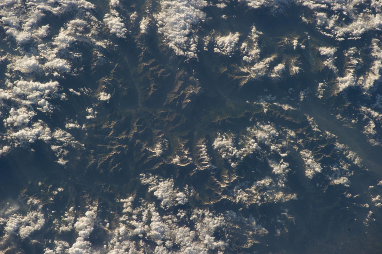 Earth Observation taken by the Expedition 40 crew aboard the International Space Station (ISS). Folder lists this as: Alps & Italy (Naples coast).