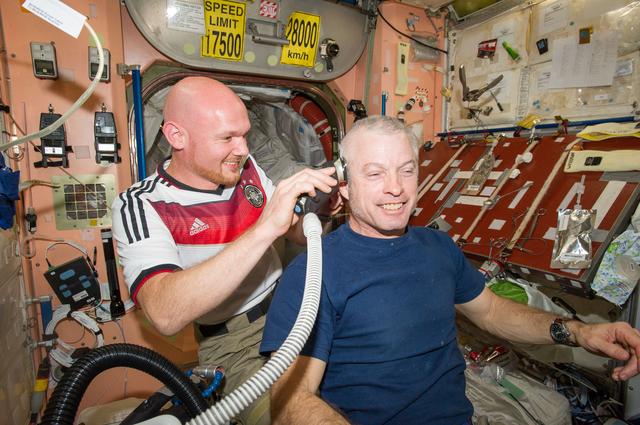 NASA image: Expedition 40 crew in Node 2 after German - U.S. soccer game