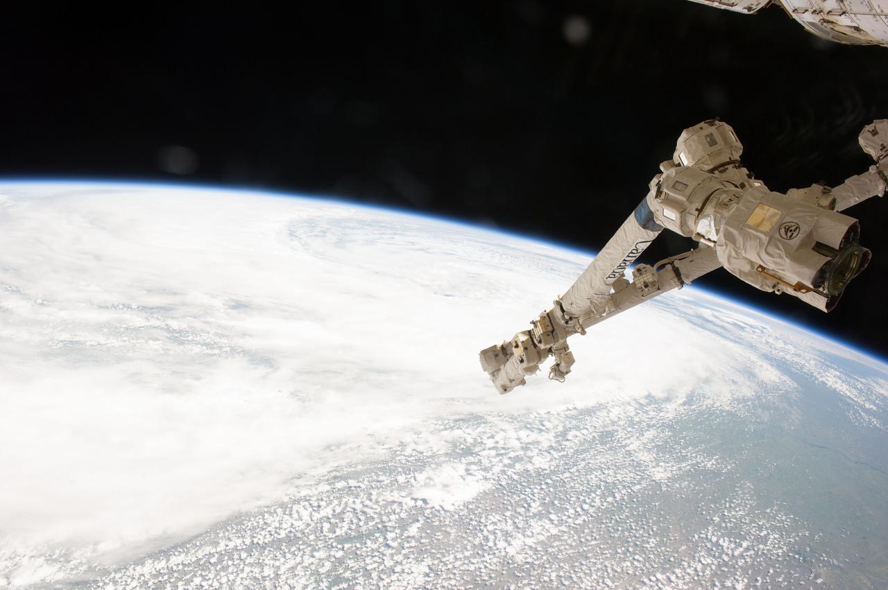 Earth observation taken during a day pass by the Expedition 40 crew aboard the International Space Station (ISS). Part of Space Station Remote Manipulator System (SSRMS) arm is visible.