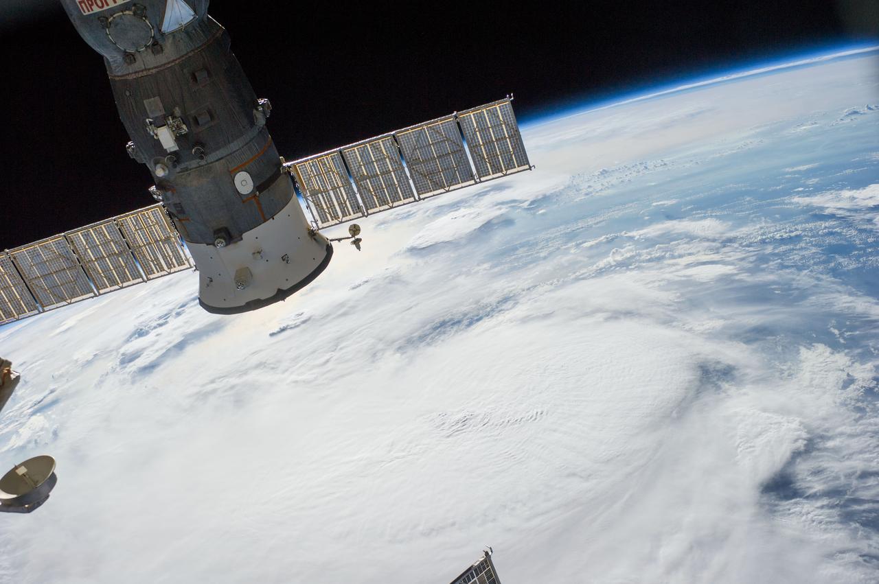 Earth Observation taken during a day pass by the Expedition 40 crew aboard the International Space Station (ISS). File lists this as: tropical storm over Atlantic. Docked Soyuz spacecraft is also visible.