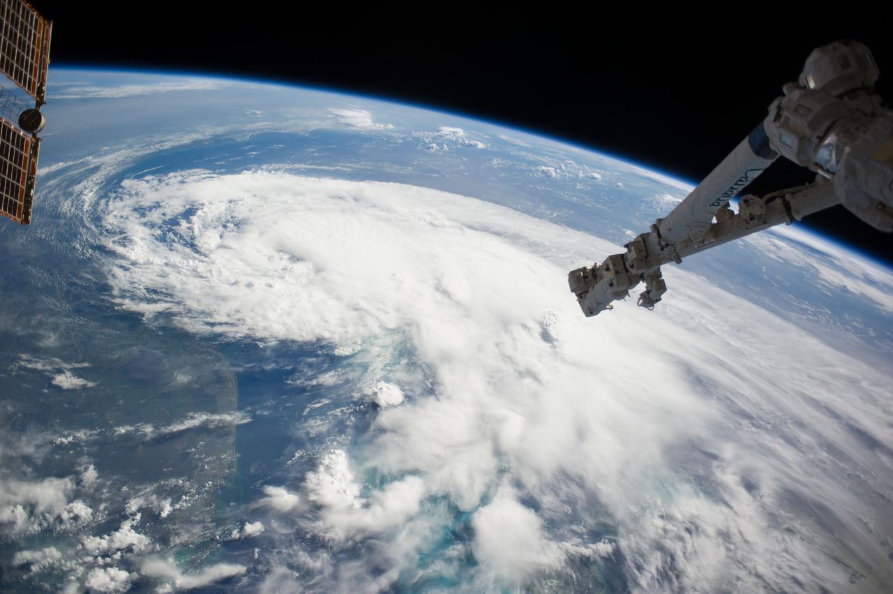 ISS040-E-030615 (2 July 2014) --- One of the Expedition 40 crew members aboard the Earth-orbiting International Space Station, some 227 nautical miles above Earth, photographed this image of Tropical Storm Arthur in the afternoon of July 2, 2014. Arthur was churning in Atlantic waters off the coast of Florida and slowly moving northward at the time the photo was taken. The robotic arm of the Space Station Remote Manipulator System or Canadarm2 is seen at upper right.