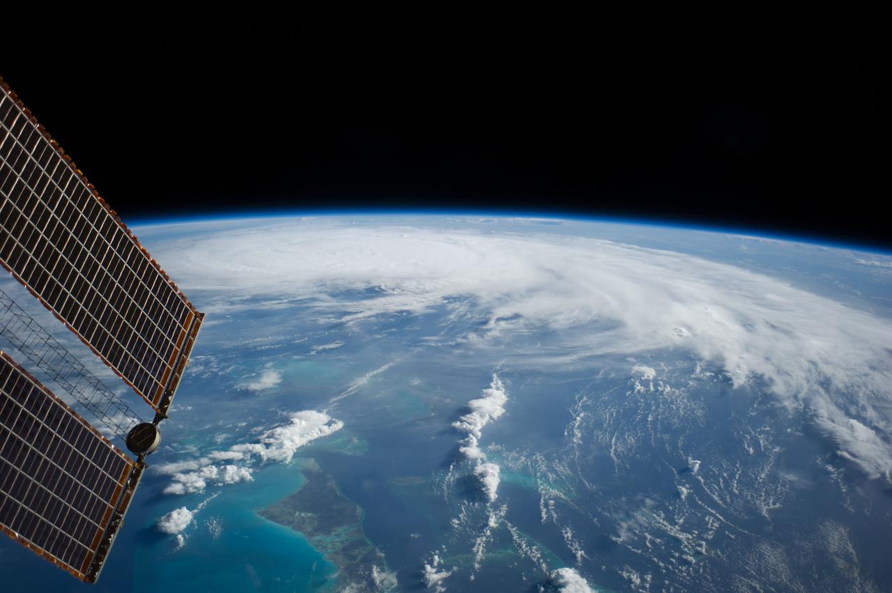 ISS040-E-031901 (3 July 2014) --- As the International Space Station was flying 227 nautical miles above the Bahama Islands, one of the Expedition 40 crew members photographed this image of Hurricane Arthur, moving northerly along the Atlantic coast line. Arthur's forecast at 11 a.m. (EDT) on July 3, 2014 projected it hitting the coast of North Carolina as a Category 2 hurricane, with winds over 100 mph, on the night of July 3 or the morning of July 4. A tip of one of the solar panels on the orbital outpost is in upper left.