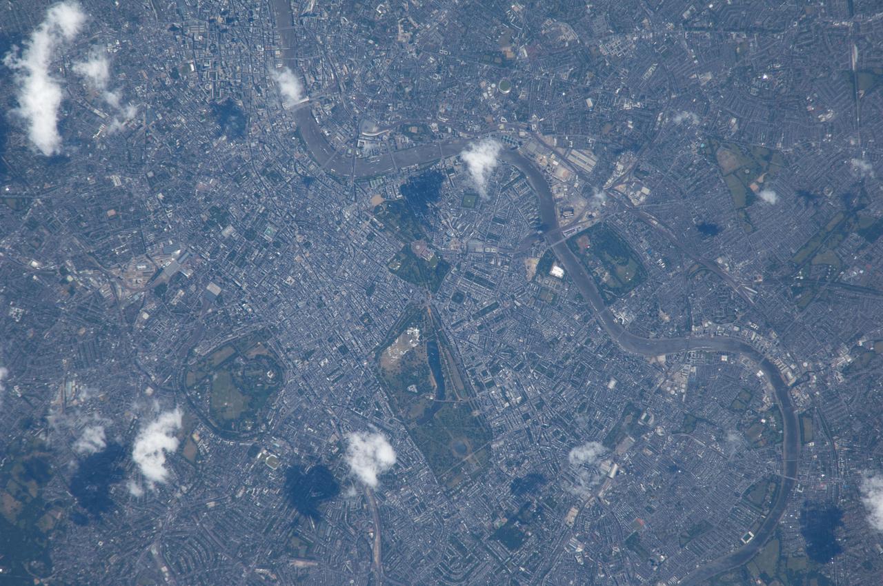 ISS040-E-033077 (4 July 2014) --- Because the Expedition 40 crew member on the International Space Station, flying at an altitude of 221 nautical miles, was using an 800mm focal length on his camera, great detail can be seen in this picture featuring a large portion of London, England. The Thames River is easily spotted snaking through the large city.