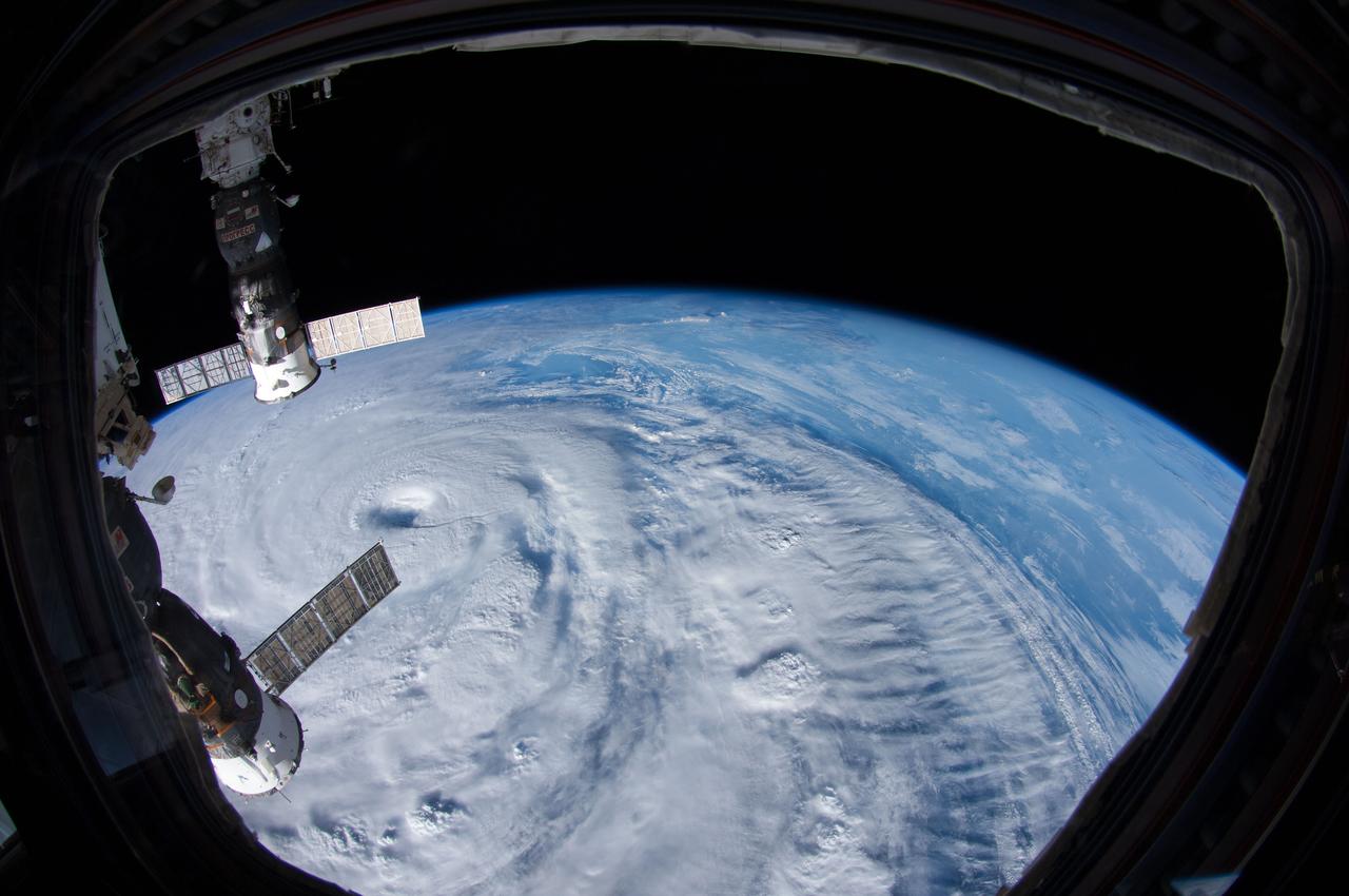 ISS040-E-042784 (7 July 2014) --- One of the Expedition 40 crew members aboard the International Space Station photographed a series of images of Typhoon Neoguri in the vicinity of Japan on July 7, 2014. This oblique 10.5 focal length view showing the eye on left side of the visible area was photographed at 21:55:38 GMT. Two docked Russian spacecraft are visible in upper left and lower left.