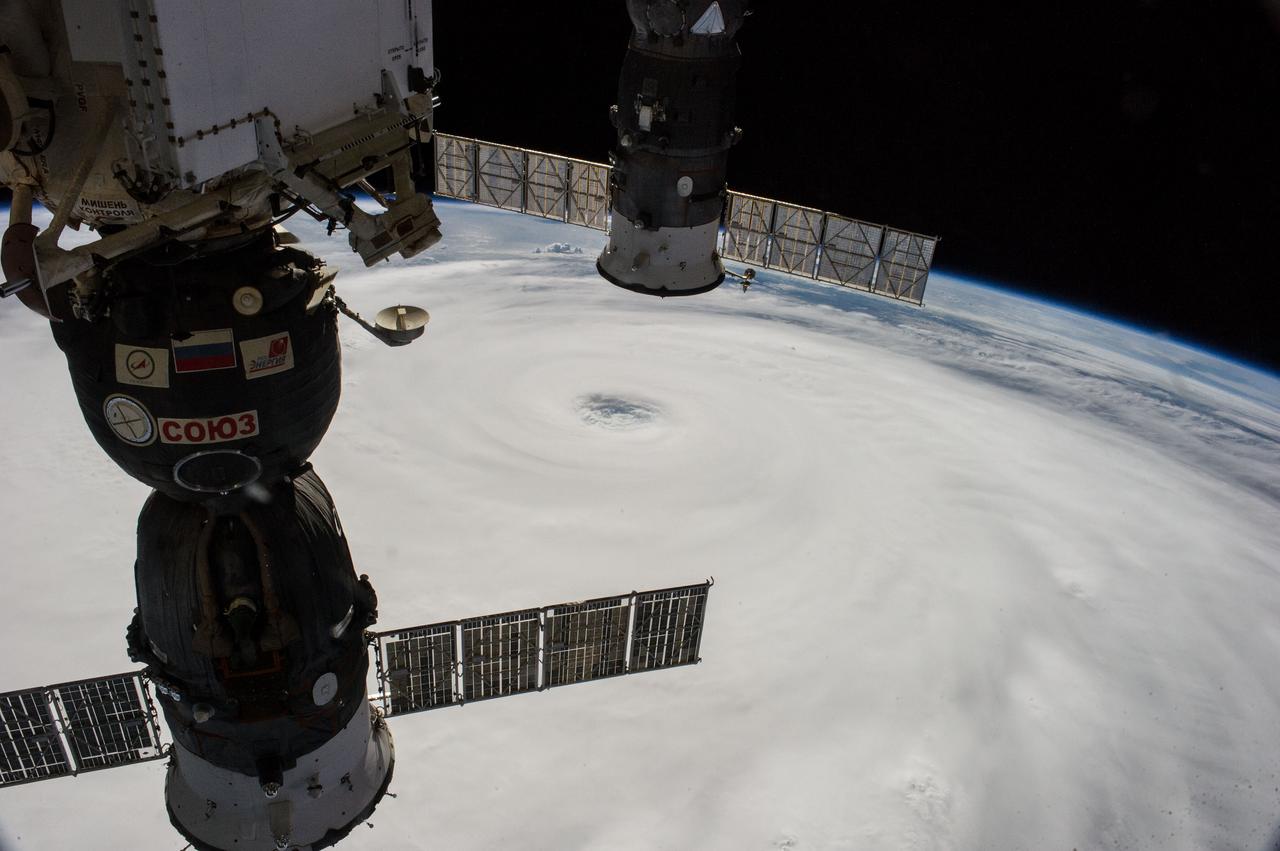 ISS040-E-045602 (7 July 2014) --- The International Space Station, including these two temporarily docked Russian spacecraft, made more than one pass near Typhoon Neoguri on July 7, and Expedition 40 Flight Engineers Reid Wiseman of NASA and Alexander Gerst of the European Space Agency captured its startling dimensions in a day-long series of still photos. In a tweet later in the day, Gerst marveled that even with a fish-eye lens he couldn't capture the whole storm. A 28mm focal length was used for a small sequence of oblique pictures such as this one. The picture was taken at 06:57:31 GMT on July 7, 2014.