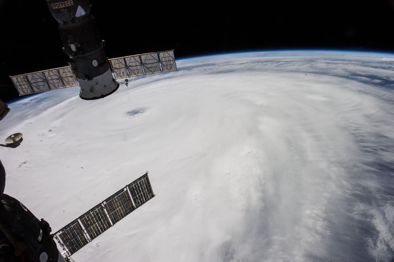 ISS040-E-045605 (7 July 2014) --- The International Space Station, including these two temporarily docked Russian spacecraft, made more than one pass near Typhoon Neoguri on July 7, and Expedition 40 Flight Engineers Reid Wiseman of NASA and Alexander Gerst of the European Space Agency captured its startling dimensions in a day-long series of still photos. In a tweet later in the day, Gerst marveled that even with a fish-eye lens he couldn't capture the whole storm. A 28mm focal length was used for a small sequence of oblique pictures such as this one. The picture was taken at 06:57:53 GMT on July 7, 2014.