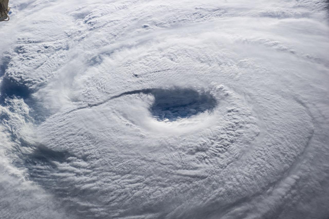 ISS040-E-045627 (7 July 2014) --- The International Space Station passed relatively near the eye of Typhoon Neoguri on July 7, and Expedition 40 Flight Engineer Alexander Gerst of the European Space Agency captured its startling dimensions in a series of still photos. In a tweet, Gerst marveled that even with a fish-eye lens (which was used on some more distant angles other than this almost vertical one), he couldn't capture the whole storm. A 70mm focal length was used for a small sequence of medium wide eye pictures such as this one. The picture was taken at 21:53:09 GMT on July 7, 2014.
