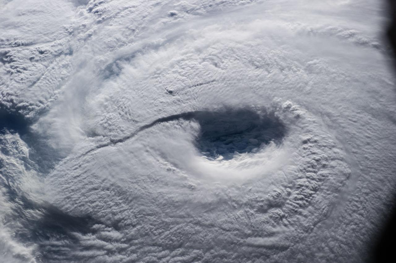 ISS040-E-045632 (7 July 2014) --- The International Space Station passed directly over the eye of Typhoon Neoguri on July 7, and Expedition 40 Flight Engineer Alexander Gerst of the European Space Agency captured its startling dimensions in a series of still photos. In a tweet, Gerst marveled that even with a fish-eye lens (which was used on some more distant angles other than this almost nadir one), he couldn't capture the whole storm. A 70mm focal length was used for a small sequence of close-up eye pictures such as this one. The picture was taken at 21:53:25 GMT on July 7, 2014.