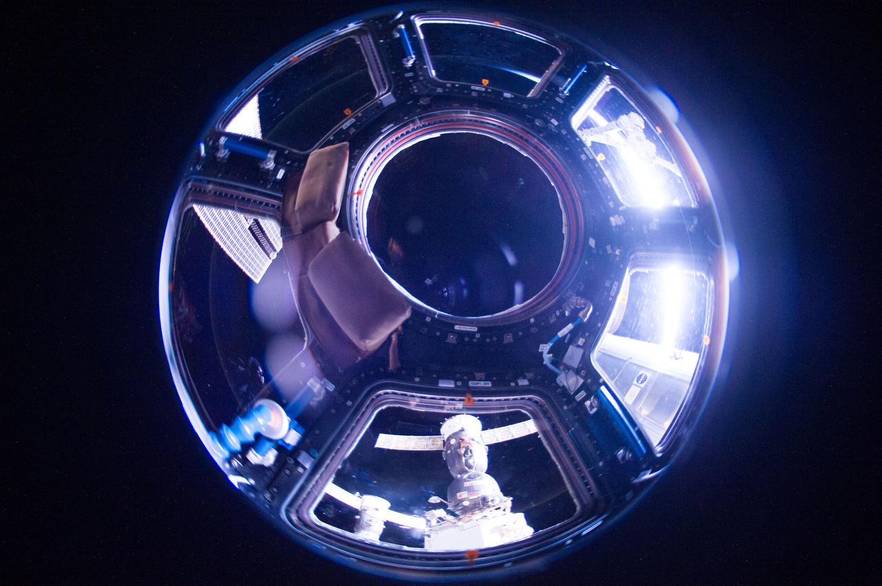 ISS040-E-047616 (6 July 2014) --- One of the Expedition 40 crew members aboard the Earth-orbiting International Space Station recorded this image from inside the Cupola approximately 225 nautical miles above Polynesia. The photo was taken on July 6, 2014 at 16:19:06 GMT. A Russian Soyuz and Russian Progress vehicle can be seen docked to the orbital outpost at bottom center.