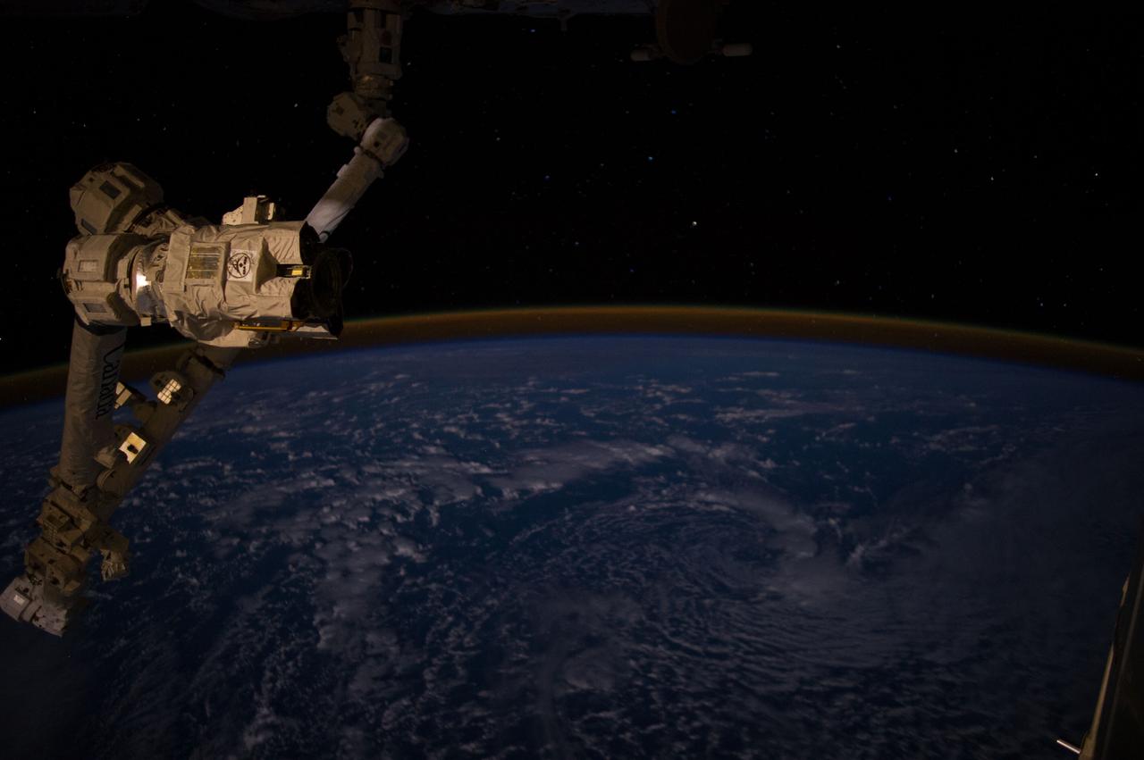 ISS040-E-052112 (8 July 2014) --- One of the Expedition 40 crew members  recorded this image from aboard the International Space Station  flying 226 nautical miles above the western Pacific Ocean on July 8 at 11:24:26 GMT.  The orbital outpost was flying above a point located at 45.4 degrees south latitude and 156.3 degrees west longitude. Part of the station's robotic arm, known as Canadarm2, is on the left side of the frame.