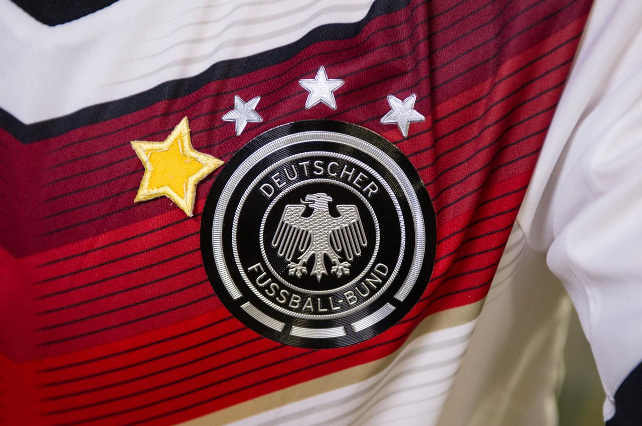 View of an Expedition 40 crewmember shirt with stars over a patch that reads Deutscher Fussbal-Bund.