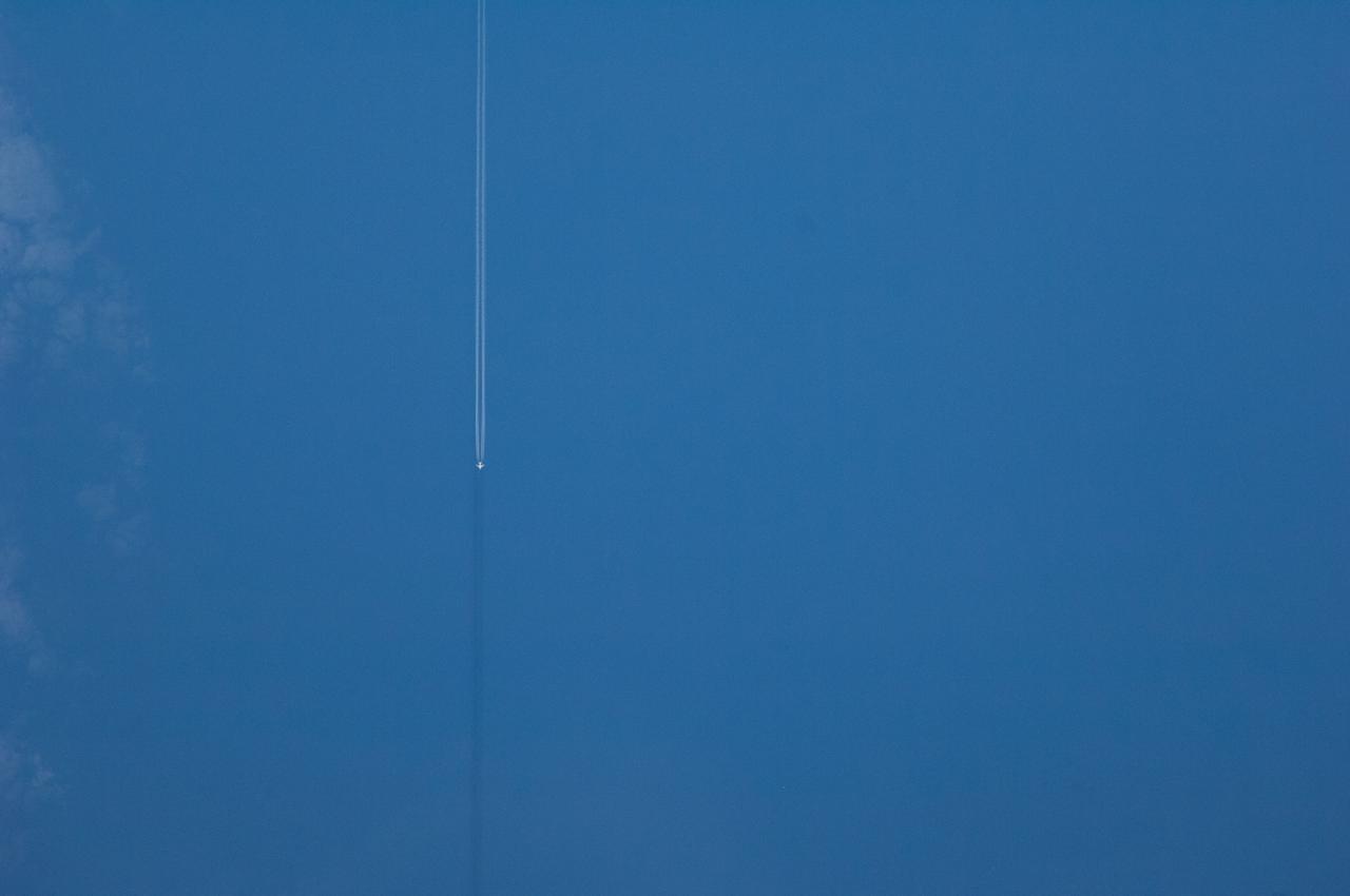 Earth Observation taken by the Expedition 40 crew aboard the International Space Station (ISS).  Outline of a plane with its contrail visible. Released via Twitter.