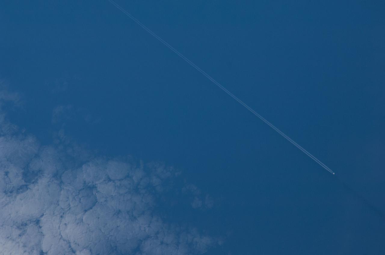Earth Observation taken by the Expedition 40 crew aboard the International Space Station (ISS).  Contrail visible.
