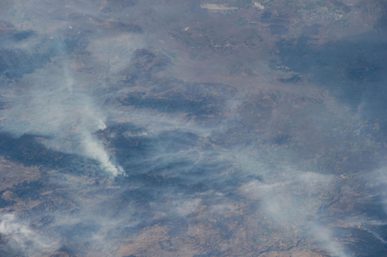 ISS040-E-070424 (19 July 2014) --- One of the Expedition 40 crew members aboard the Earth-orbiting International Space Station recorded this July 19 image of wildfires which are plaguing the Northwest and causing widespread destruction. The orbital outpost was flying 223 nautical miles above Earth at the time of the photo. Lightning has been given as the cause of the Ochoco Complex fires in the Ochoco National Forest in central Oregon. The complex has gotten larger since this photo was taken.