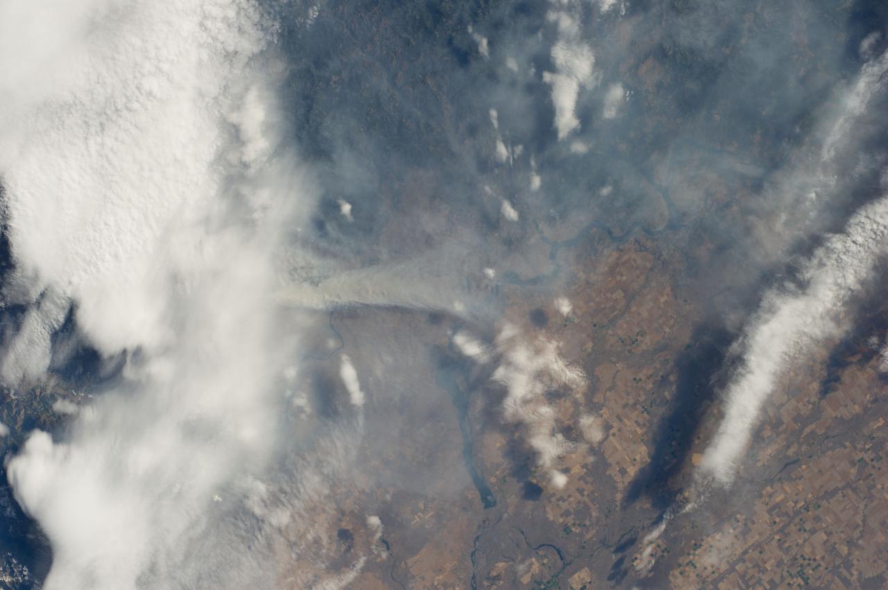 ISS040-E-070439 (19 July 2014) --- One of the Expedition 40 crew members aboard the Earth-orbiting International Space Station recorded this July 19 image of wildfires which are plaguing the Northwest and causing widespread destruction. The orbital outpost was flying 223 nautical miles above a point on Earth located at 48.0 degrees north latitude and 116.9 degrees west longitude when the image was exposed. The state of Washington is especially affected by the fires, many of which have been blamed on lightning. This particular fire was part of the Carlton Complex Fire, located near the city of Brewster in north central Washington. The reservoir visible near the center of the image is Banks Lake.