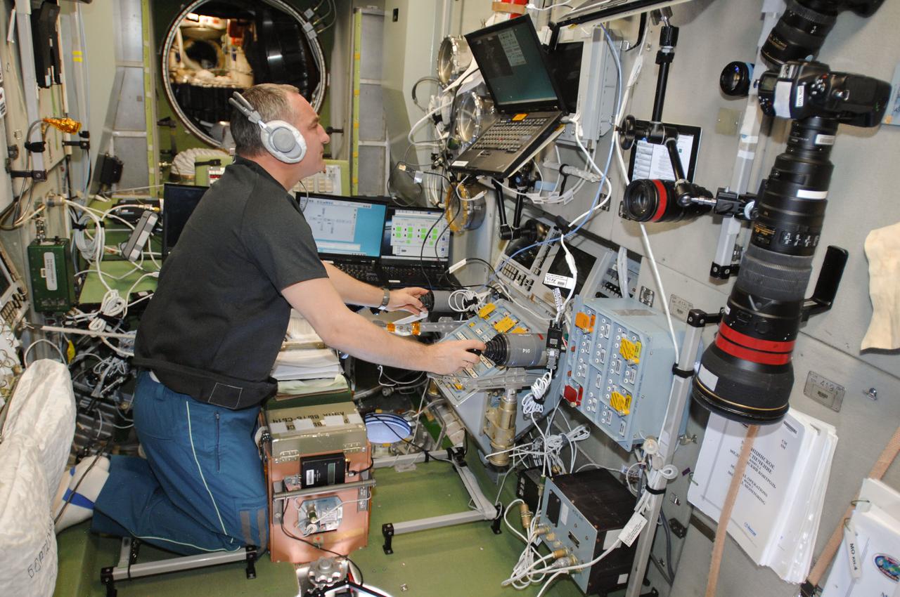 ISS040-E-070856 (22 July 2014) --- Russian cosmonaut Alexander Skvortsov, Expedition 40 flight engineer, practices manual docking techniques with the TORU, or telerobotically operated rendezvous system, in the Zvezda Service Module of the International Space Station in preparation for the docking of the Progress 56 spacecraft. Skvortsov, using the Simvol-TS screen and hand controllers, could manually dock the Progress to the station in the event of a failure of the Kurs automated docking system. The Progress 56 craft is scheduled to complete its automated docking to the Pirs docking compartment at 11:30 p.m. (EDT) on July 23, 2014.