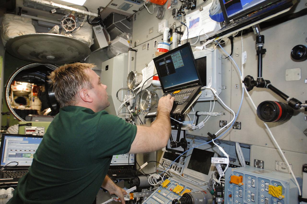 ISS040-E-070861 (22 July 2014) --- Russian cosmonaut Maxim Suraev, Expedition 40 flight engineer, practices manual docking techniques with the TORU, or telerobotically operated rendezvous system, in the Zvezda Service Module of the International Space Station in preparation for the docking of the Progress 56 spacecraft. Suraev, using the Simvol-TS screen and hand controllers, could manually dock the Progress to the station in the event of a failure of the Kurs automated docking system. The Progress 56 craft is scheduled to complete its automated docking to the Pirs docking compartment at 11:30 p.m. (EDT) on July 23, 2014.