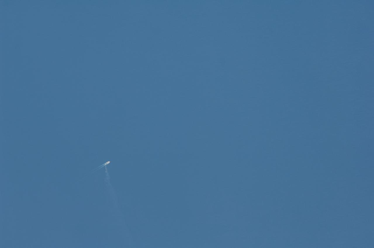 Earth Observation taken during a day pass by the Expedition 40 crew aboard the International Space Station (ISS). Boat and contrail behind it.