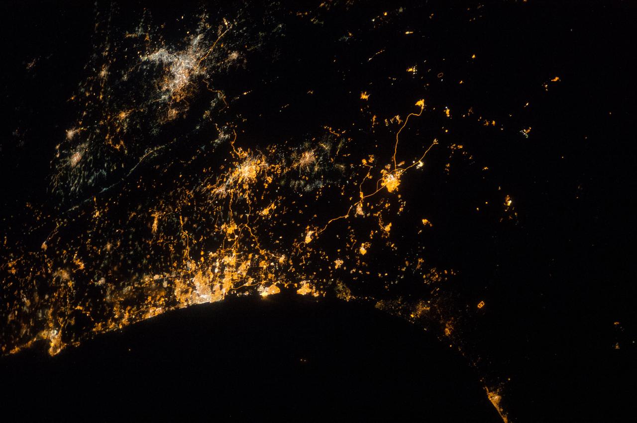 ISS040-E-074022 (22 July 2014) --- Because of city lights, several points in the mid-east along the Eastern Mediterranean Sea coast and a bit inland can be delineated in this early morning view photographed by one of the Expedition 40 crew members aboard the Earth-orbiting International Space Station on July 22, 2014. A portion of the Mediterranean Sea is at the bottom of this image. The orbital outpost was flying at an altitude of approximately 223 nautical miles above a point the coordinates of which are 29.8 degrees north latitude and 32.3 degrees east longitude (near the Suez Canal) when the image was exposed, using an 85mm lens.