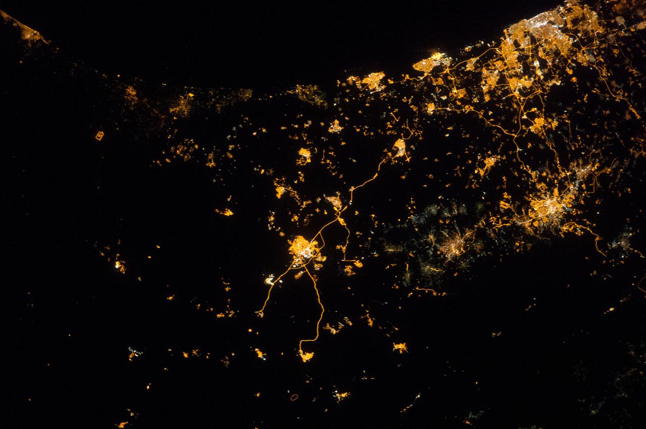 ISS040-E-074047 (22 July 2014) --- Because of city lights, several points in the mid-east along the Eastern Mediterranean Sea coast and a bit inland can be delineated in this early morning view photographed by one of the Expedition 40 crew members aboard the Earth-orbiting International Space Station on July 22, 2014. A portion of the Mediterranean Sea is at the top (northwest) of this image. The orbital outpost was flying at an altitude of approximately 223 nautical miles above a point the coordinates of which are 31.7 degrees north latitude and 34.4 degrees east longitude when the image was exposed, using an 85mm lens.