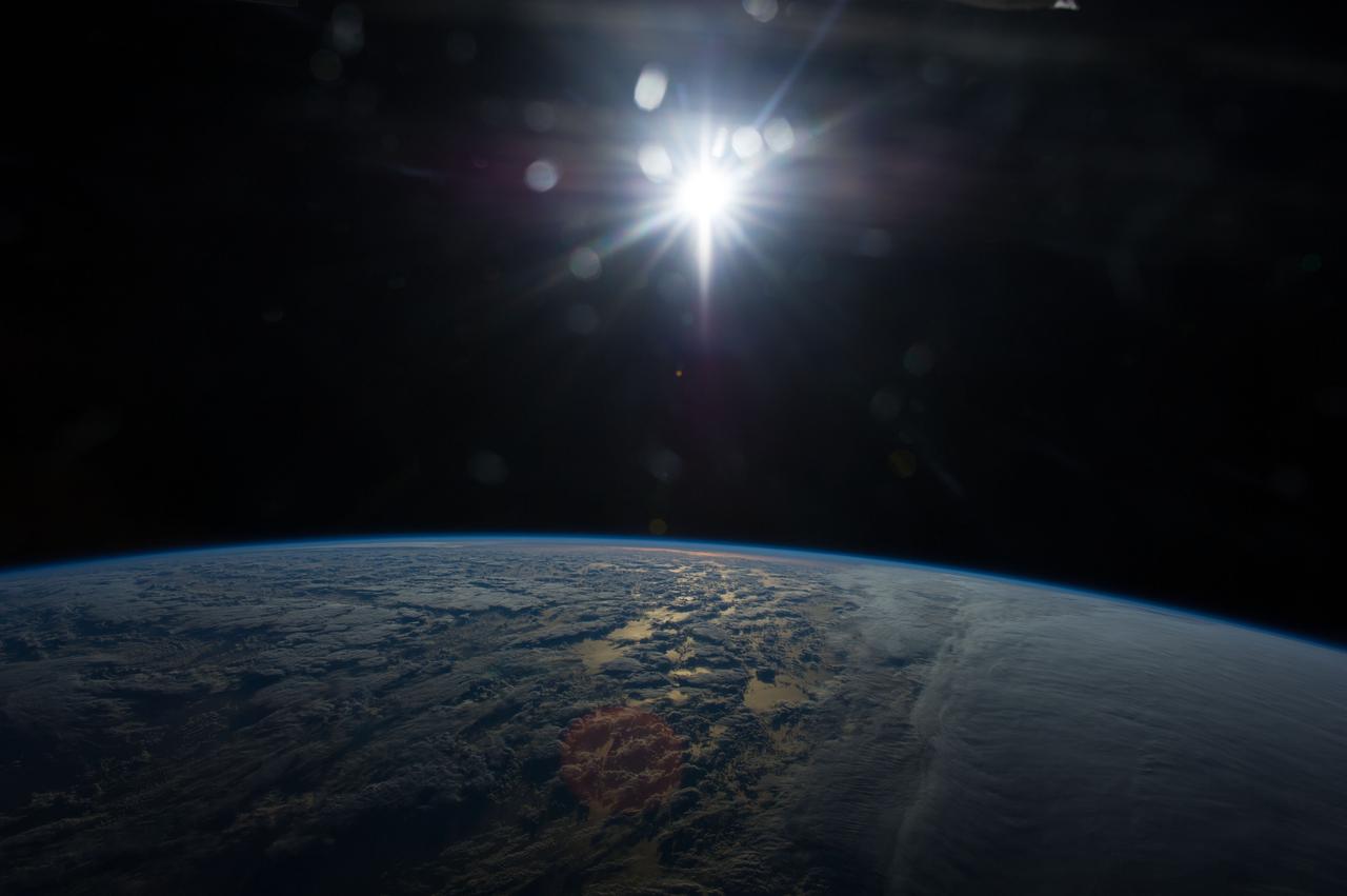 Earth Observation taken during a day pass by the Expedition 40 crew aboard the International Space Station (ISS). Folder lists this as: Sunset over southern atlantic ocean.