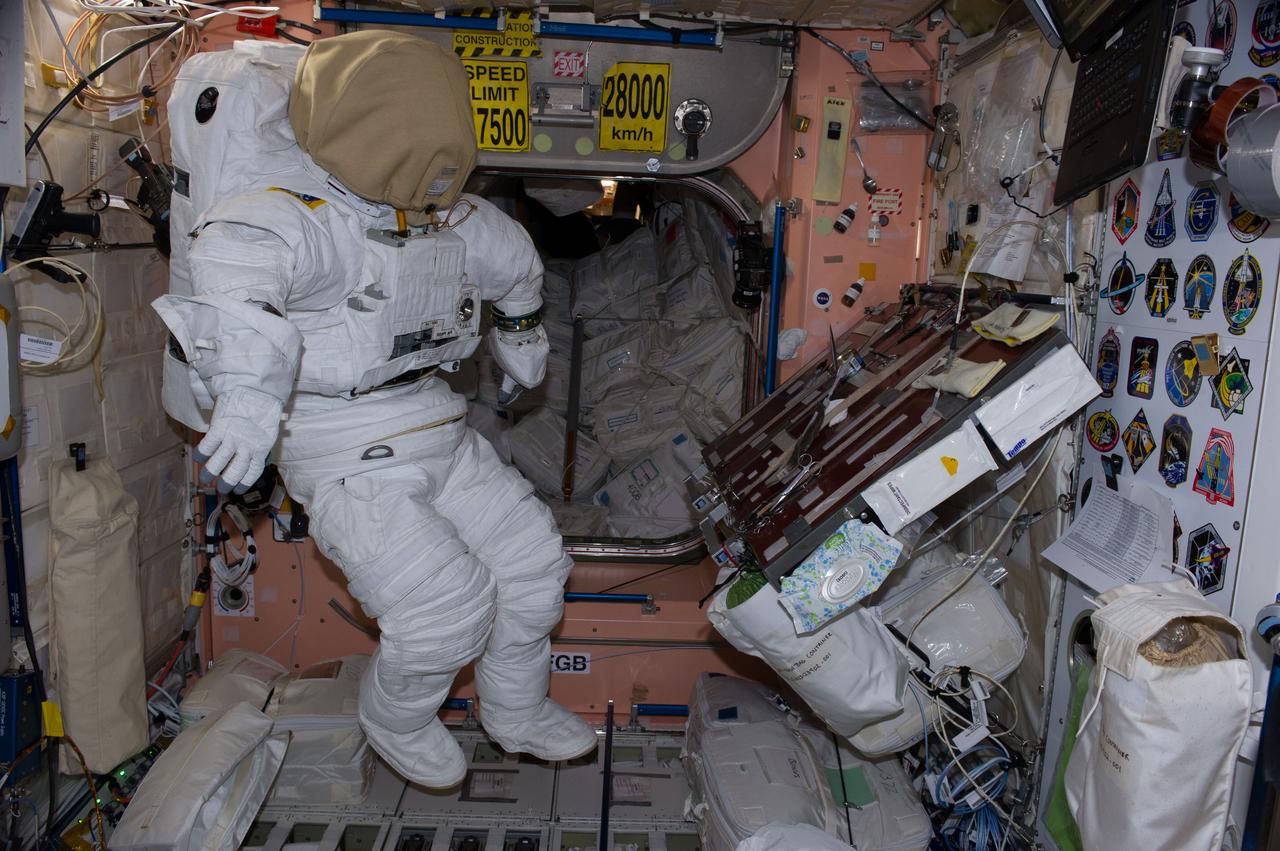 ISS040-E-080780 (28 July 2014) --- Photographed by an Expedition 40 crew member, an empty Extravehicular Mobility Unit (EMU) spacesuit is pictured near the gallery in the Unity node of the International Space Station.