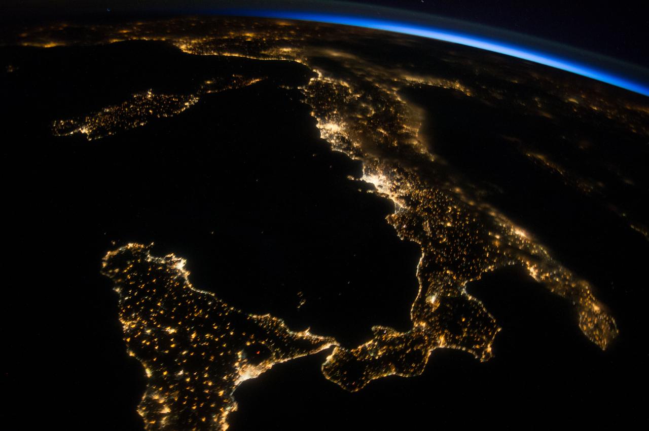 ISS040-E-080967 (26 July 2014) --- One of the Expedition 40 crew members aboard the International Space Station photographed this oblique night image of almost the entire country of Italy and the islands of Sicily, Corse and Sardinia on July 26, 2014.