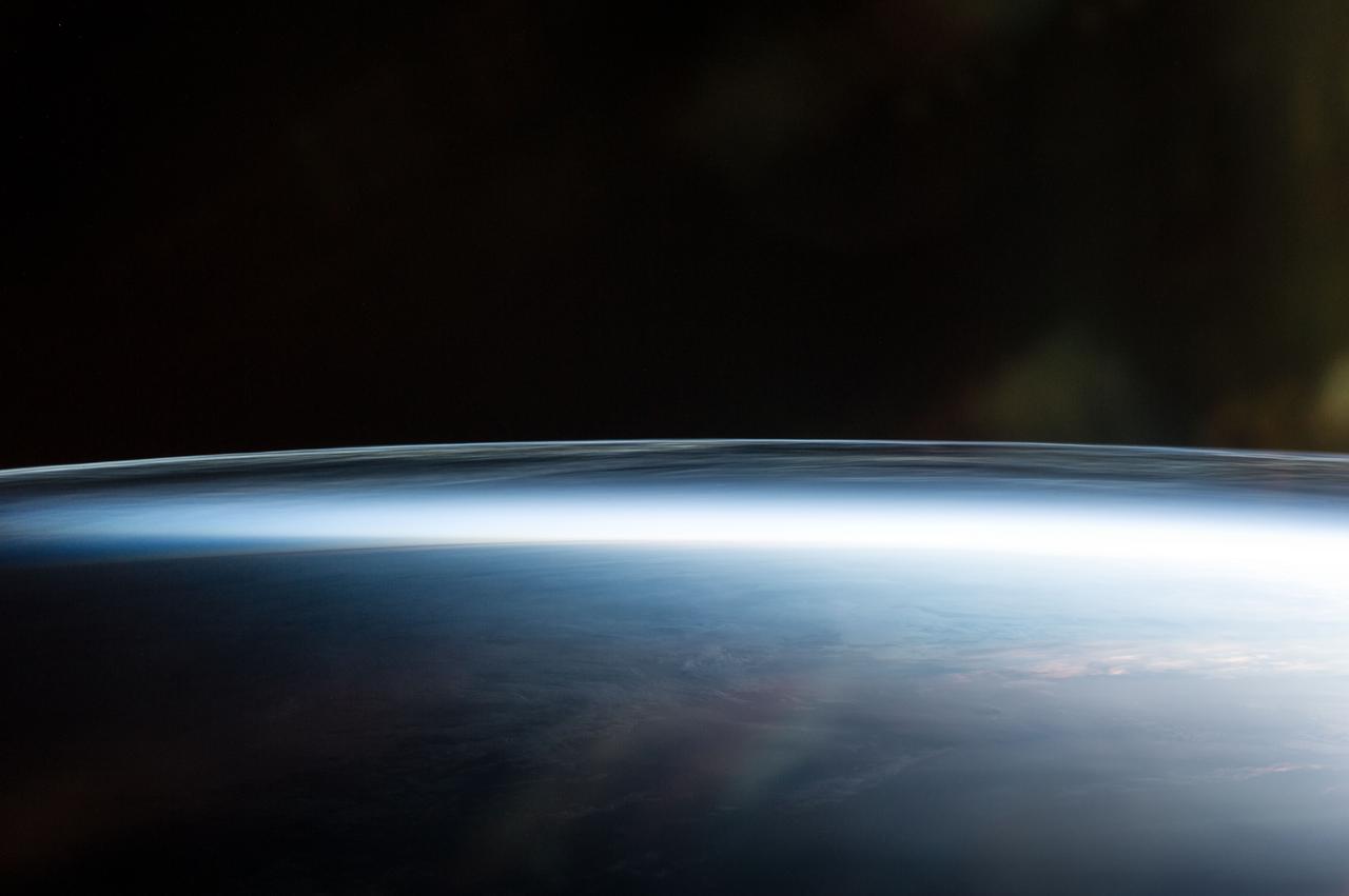 Earth Observation taken during a night pass by the Expedition 40 crew aboard the International Space Station (ISS). Folder lists this as: Polar Mesospheric Clouds over Canada.