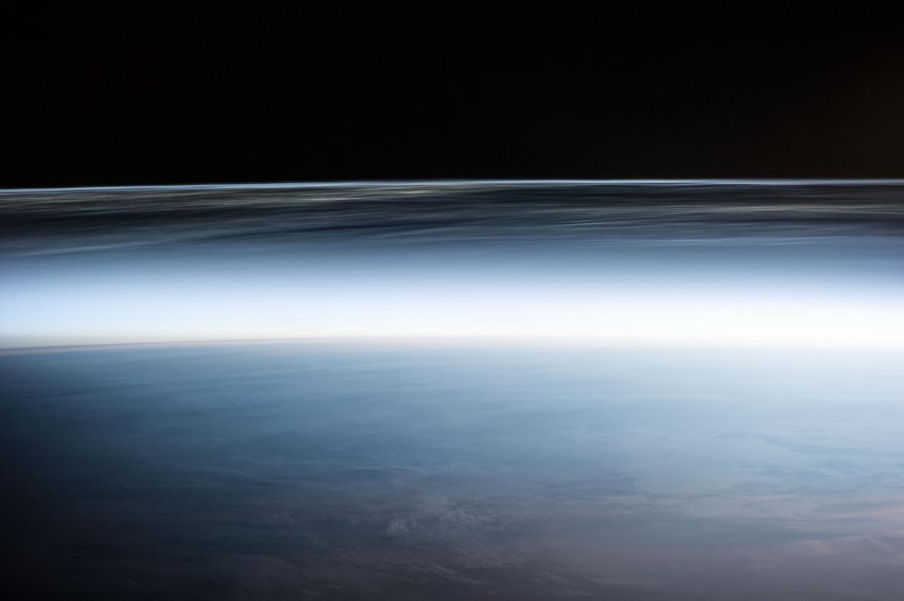 Earth Observation taken during a night pass by the Expedition 40 crew aboard the International Space Station (ISS). Folder lists this as: Polar Mesospheric Clouds over Canada.