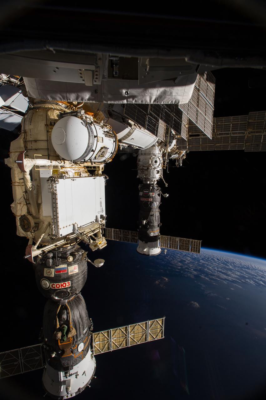 Earth Observation taken during a day pass by the Expedition 40 crew aboard the International Space Station (ISS). Docked Soyuz and Progress spacecraft are visible in the foreground.