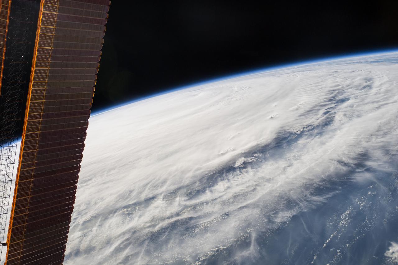 ISS040-E-089379 (7 Aug. 2014) --- One of the Expedition 40 crew members aboard the International Space Station, from an altitude of 221 nautical miles, photographed this image of Typhoon Halong at 08:02:41 GMT on Aug. 7, 2014. The orbital outpost was flying above a point on Earth located at 15.8 degrees north latitude and 142.4 degrees east longitude. One of the solar panels of the orbital outpost is seen on the left side of the scene.