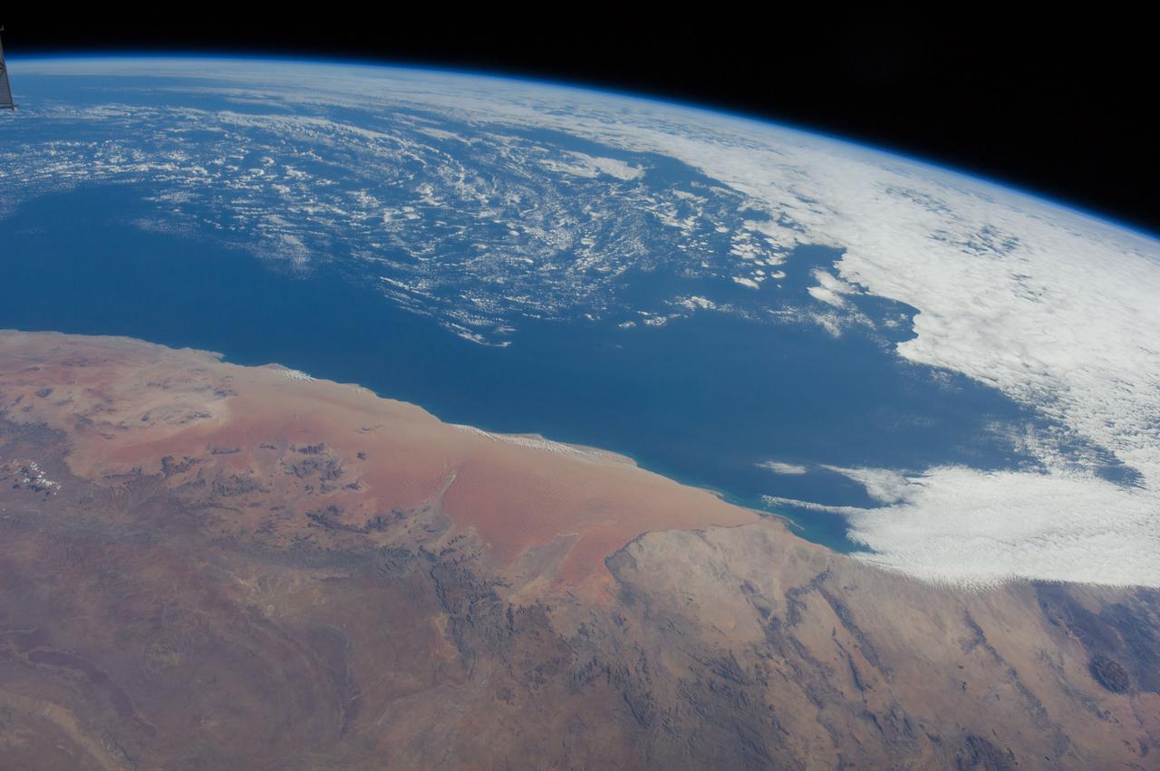 Earth observation taken by the Expedition 40 crew aboard the International Space Station (ISS). Folder lists this as: glancing shot of Africa's red dunes.