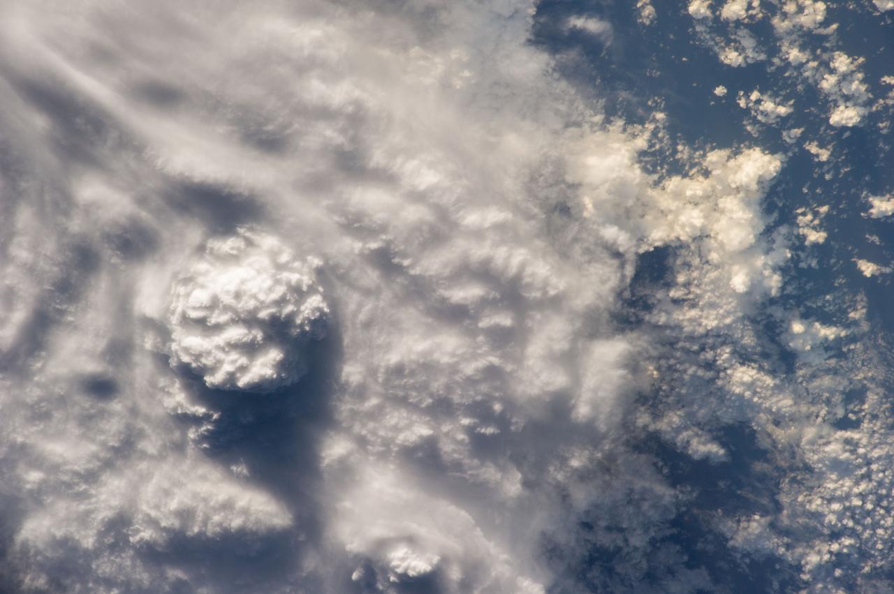 Earth observation taken by the Expedition 40 crew aboard the International Space Station (ISS). Folder lists this as: Cloud shadows over Indonesia.