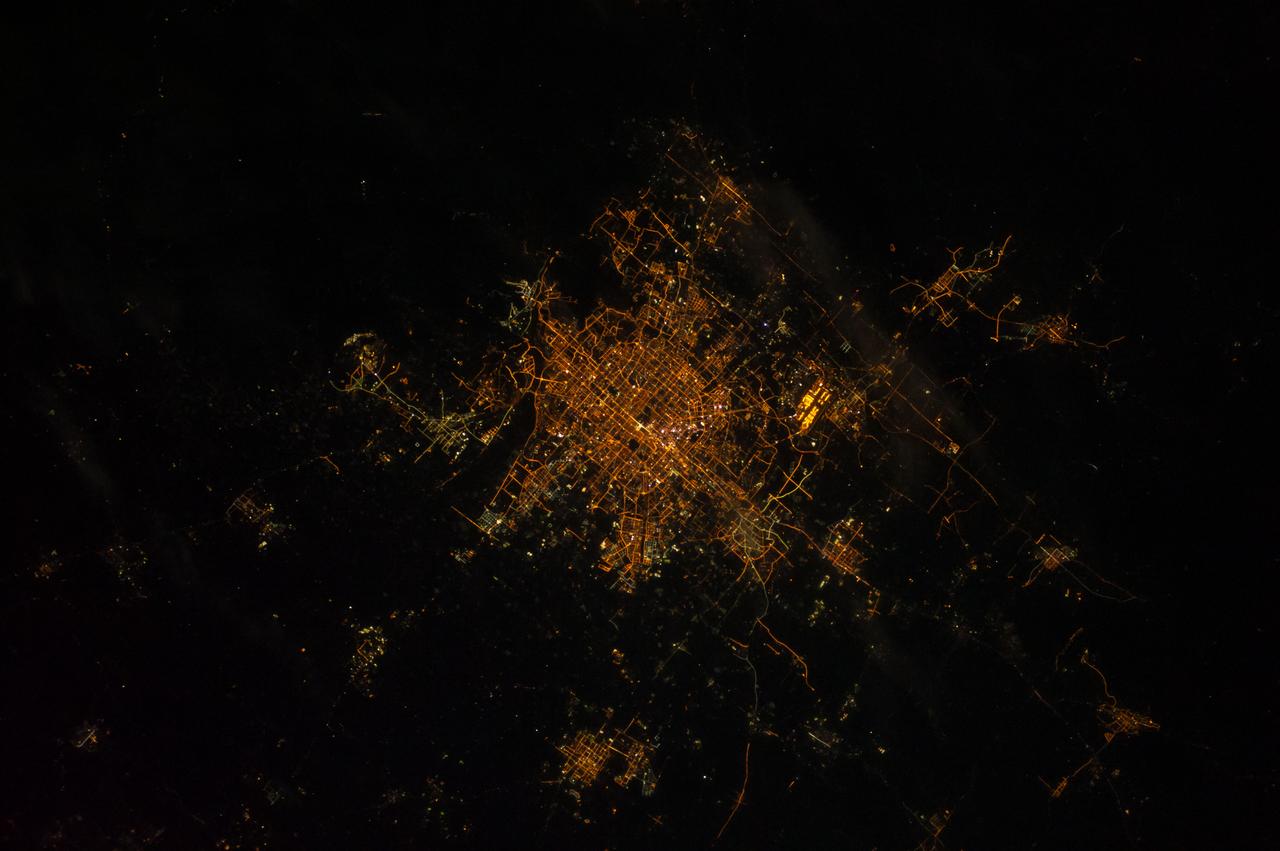Earth observation taken during a night pass by the Expedition 40 crew aboard the International Space Station (ISS). Folder lists this as: Perhaps Beijing.