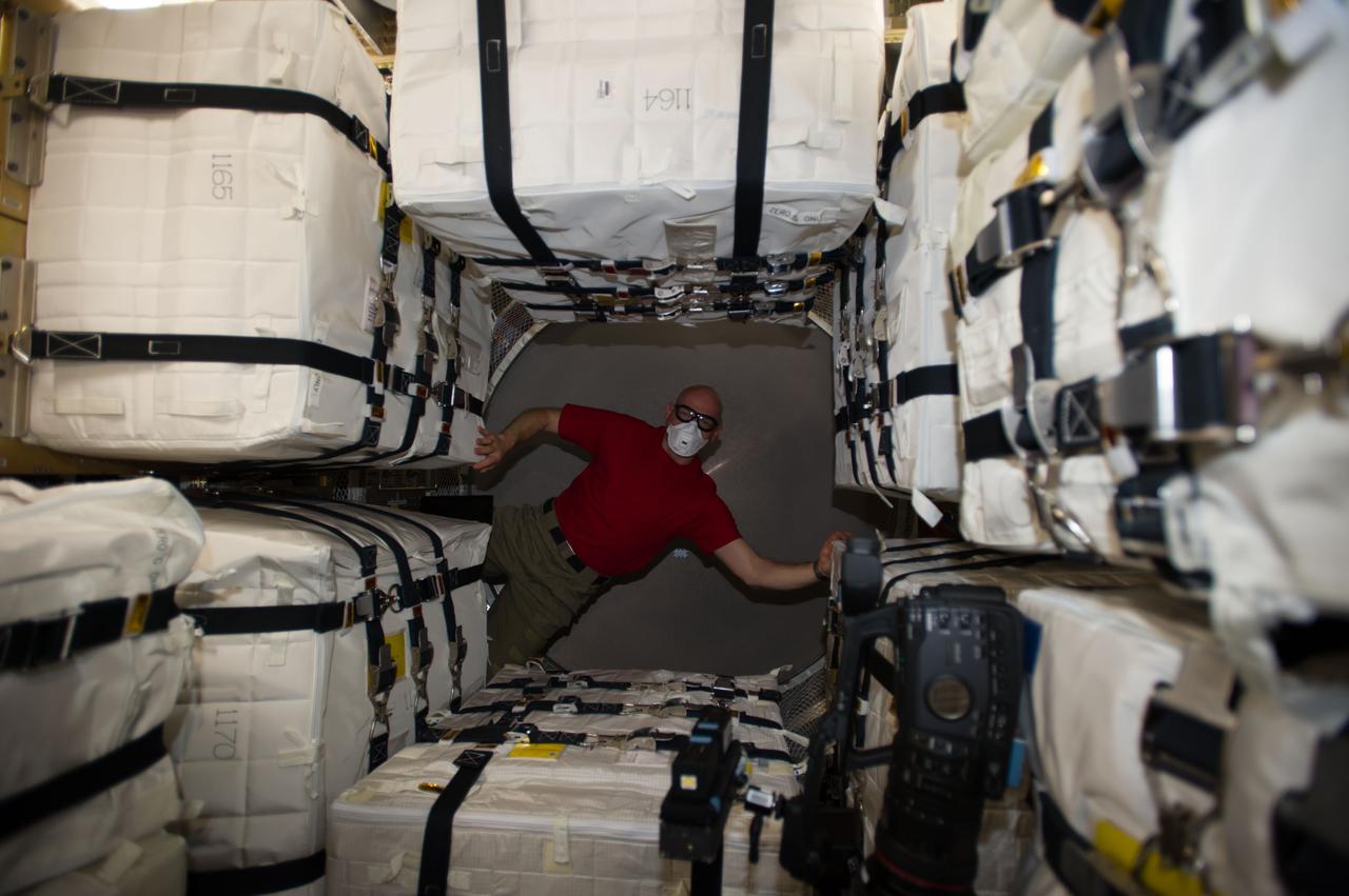 ISS040-E-091969 (13 Aug. 2014) --- Surrounded by stowage containers, European Space Agency astronaut Alexander Gerst, Expedition 40 flight engineer, is pictured in the newly-attached "Georges Lemaitre" Automated Transfer Vehicle-5 (ATV-5) of the International Space Station.