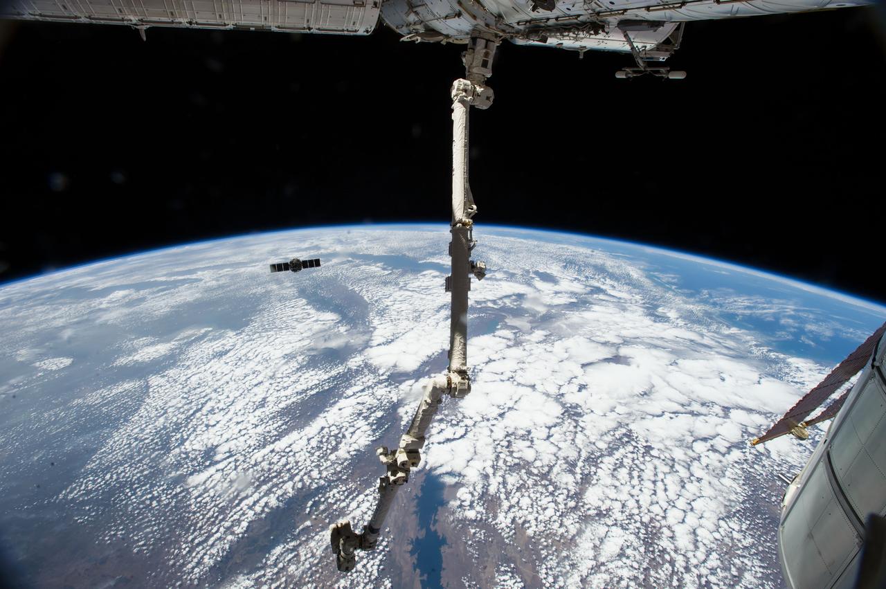 ISS040-E-095260 (15 Aug. 2014) --- The Orbital Sciences' Cygnus commercial cargo craft begins its relative separation from the International Space Station after a month visiting the orbital outpost. European Space Agency astronaut Alexander Gerst and NASA astronaut Reid Wiseman, both Expedition 40 flight engineers, were at the controls of the robotics workstation in the Cupola removing Cygnus from the Harmony node then safely releasing at 6:40 a.m. (EDT) Aug. 15, 2014.