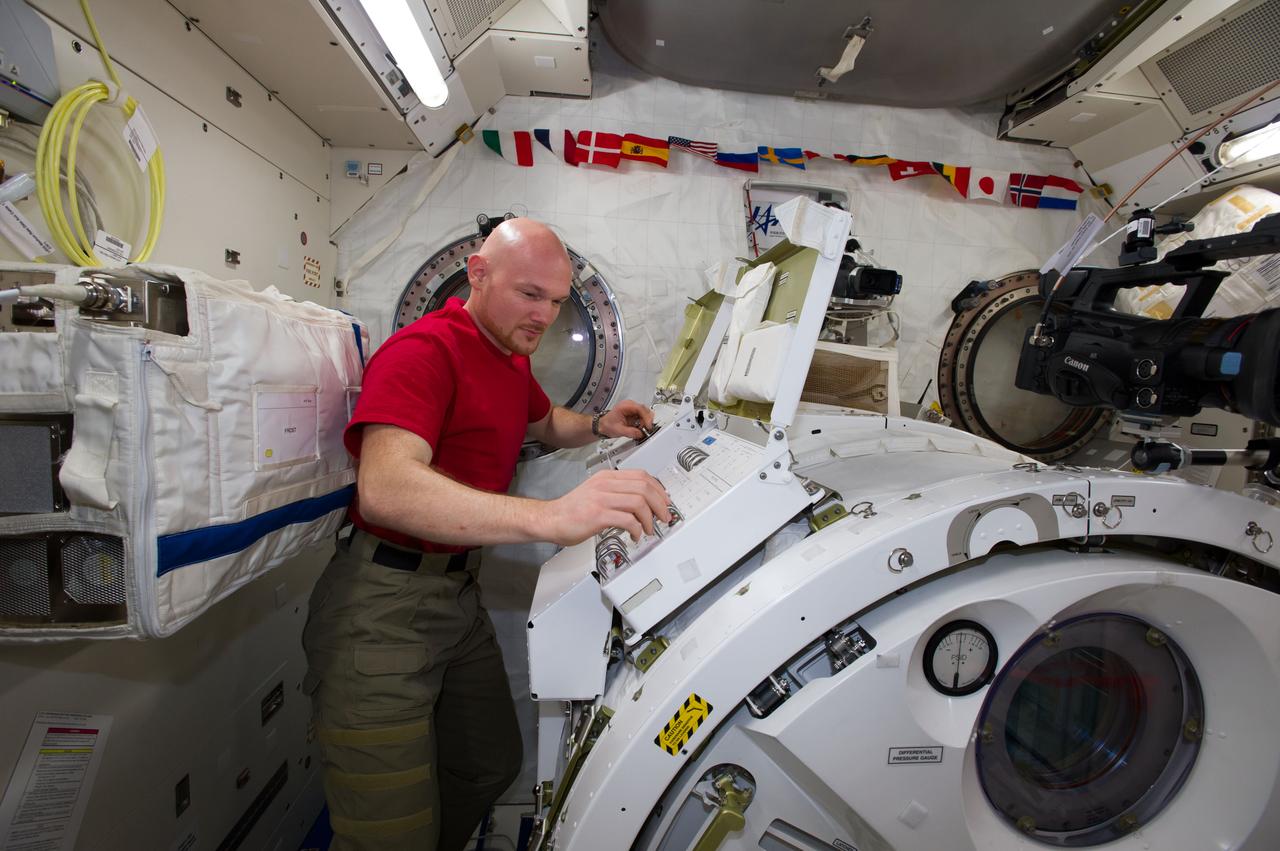 ISS040-E-096126 (18 Aug. 2014) --- In the International Space Station?s Kibo laboratory, European Space Agency astronaut Alexander Gerst, Expedition 40 flight engineer, depressurizes the Kibo airlock in preparation for a series of NanoRacks CubeSat miniature satellite deployments. The first two pairs of nanosatellites are scheduled for deployment on Aug. 19. The Planet Labs Dove satellites that were carried to the station aboard the Orbital Sciences Cygnus commercial cargo craft are being deployed between Aug. 19 and Aug. 25.