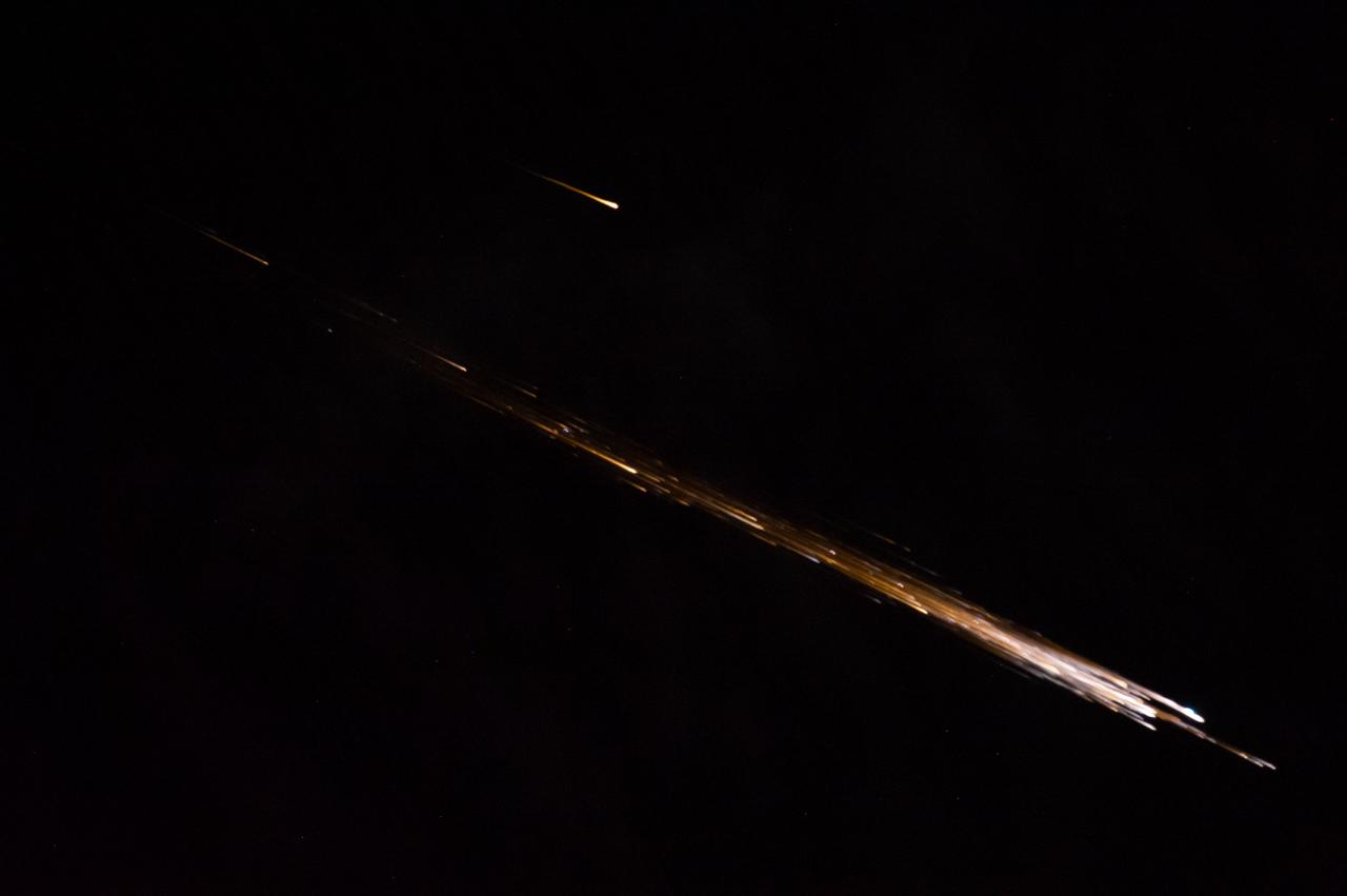 ISS040-E-098571 (17 Aug. 2014) --- One of the Expedition 40 crew members aboard the International Space Station recorded this image of the Orbital Sciences Corporation's Cygnus cargo carrier spacecraft breaking up in Earth's atmosphere after being released from the orbital outpost. The breakup started around 13:22 GMT on Aug. 17, 2014 and this photo was taken at 13:23:32 GMT.