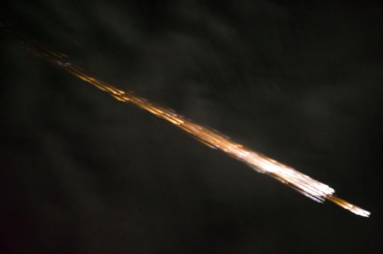 ISS040-E-098592 (17 Aug. 2014) --- One of the Expedition 40 crew members aboard the International Space Station recorded this image of the Orbital Sciences Corporation's Cygnus cargo carrier spacecraft breaking up in Earth's atmosphere after being released from the orbital outpost. The breakup started around 13:22 GMT on Aug. 17, 2014 and this photo was taken at 13:23:45 GMT.