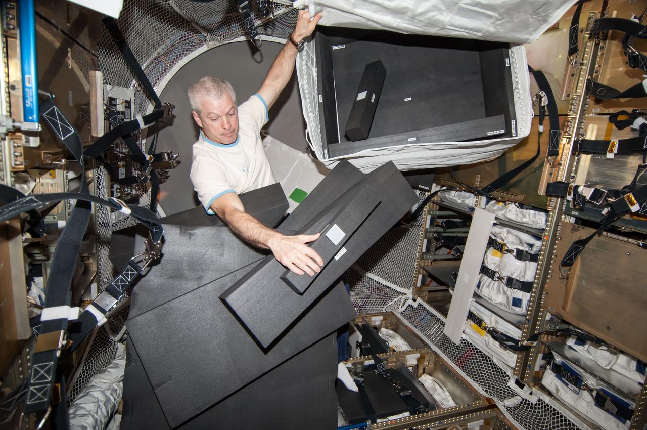ISS040-E-103991 (21 Aug. 2014) --- NASA astronaut Steve Swanson, Expedition 40 commander, is pictured during cargo transfer operations in the "Georges Lemaitre" Automated Transfer Vehicle-5 (ATV-5) currently docked with the International Space Station.