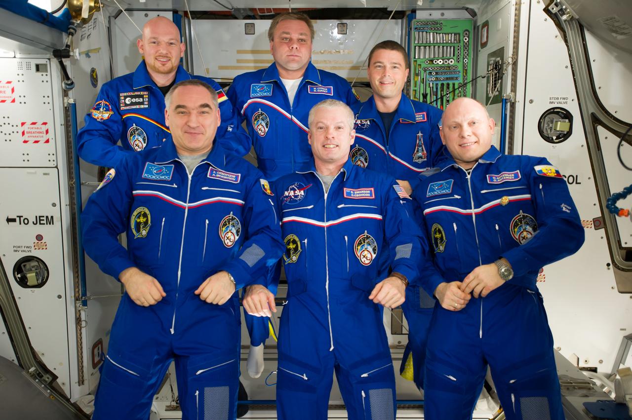 ISS040-E-105139 (23 Aug. 2014) --- Expedition 40 crew members pose for an in-flight crew portrait in the Harmony node of the International Space Station. Pictured on the front row are NASA astronaut Steve Swanson (center), commander; along with Russian cosmonauts Alexander Skvortsov (left) and Oleg Artemyev, both flight engineers. Pictured from the left (back row) are European Space Agency astronaut Alexander Gerst, Russian cosmonaut Maxim Suraev and NASA astronaut Reid Wiseman, all flight engineers.