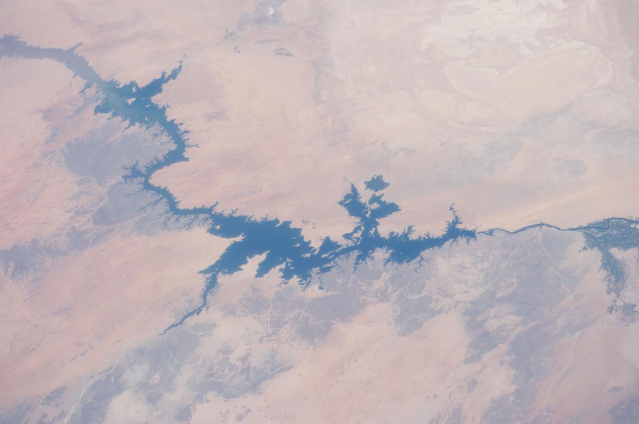 ISS040-E-105768 (23 Aug. 2014) --- One of the Expedition 40 crew members aboard the International Space Station, flying at an altitude of 221 nautical miles, captured this image of Egypt's Nile River and Lake Nasser on Aug. 23, 2014. The Aswan High Dam is to the right of center in the 70mm focal-length image, as the Nile flows southward (to the right in this image) toward Cairo and it?s Mediterranean delta (both out of frame at right). The Red Sea, which runs more or less parallel to the Nile, is out of frame at bottom.