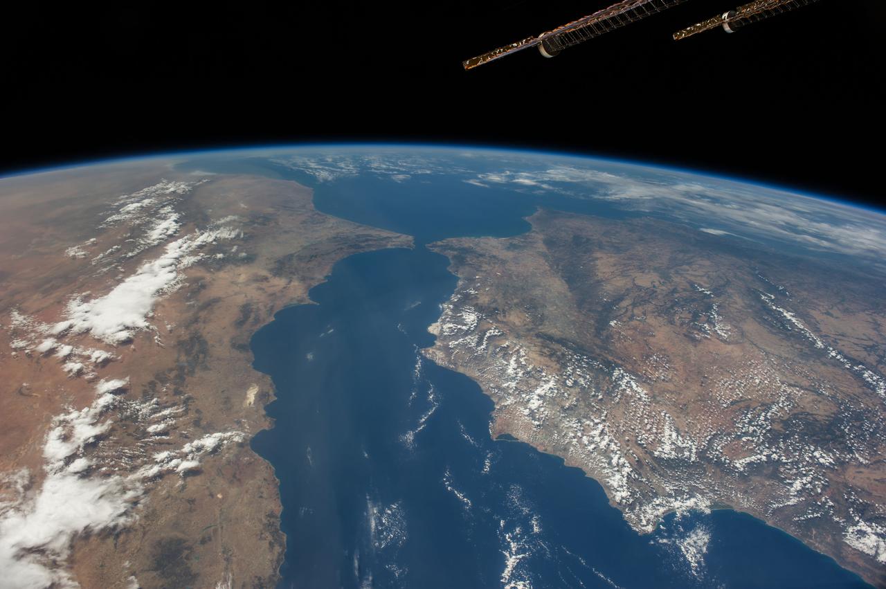 ISS040-E-105800 (23 Aug. 2014) --- One of the Expedition 40 crew members aboard the International Space Station, flying at an altitude of 220 nautical miles, recorded this oblique panorama showing almost the entire Iberian Peninsula (Spain and Portugal) at right, Morocco and other parts of Africa  (left) and the Strait of Gibraltar (top center) on Aug. 23, 2014. A 28mm focal length was used.