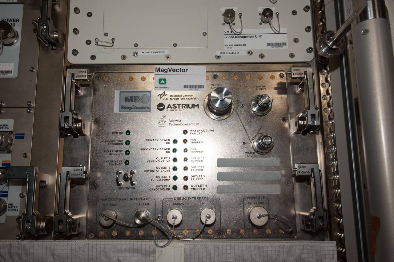 iss040e108291 (8/26/2014) --- Photographic documentation of final installation of MAGVECTOR hardware in the Columbus module aboard the International Space Station (ISS). MAGVECTOR qualitatively investigates the interaction between a moving magnetic field and an electrical conductor. The set up will provide initial insights regarding the principal feasibility on board the ISS,future improvements and phenomenological trends and dependencies. The expected changes in the magnetic field structure on the Ram and Wake side of the electrical conductor are of interest for technical applications as well as for astrophysical research.