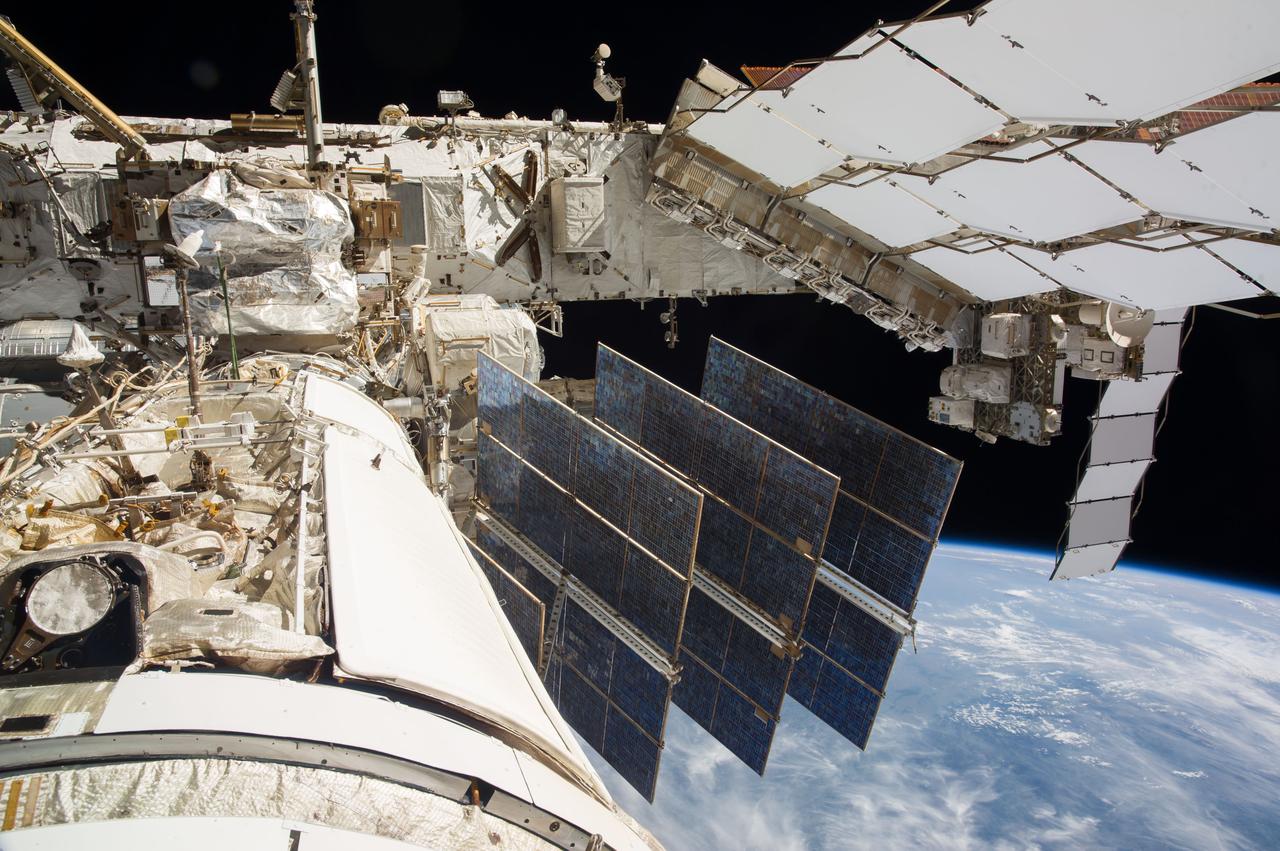 ISS040-E-123162 (2 Sept. 2014) --- A portion of the Russian segment of the International Space Station is featured in this image photographed by an Expedition 40 crew member onboard the station. A blue and white part of Earth and the blackness of space provide the backdrop for the scene.